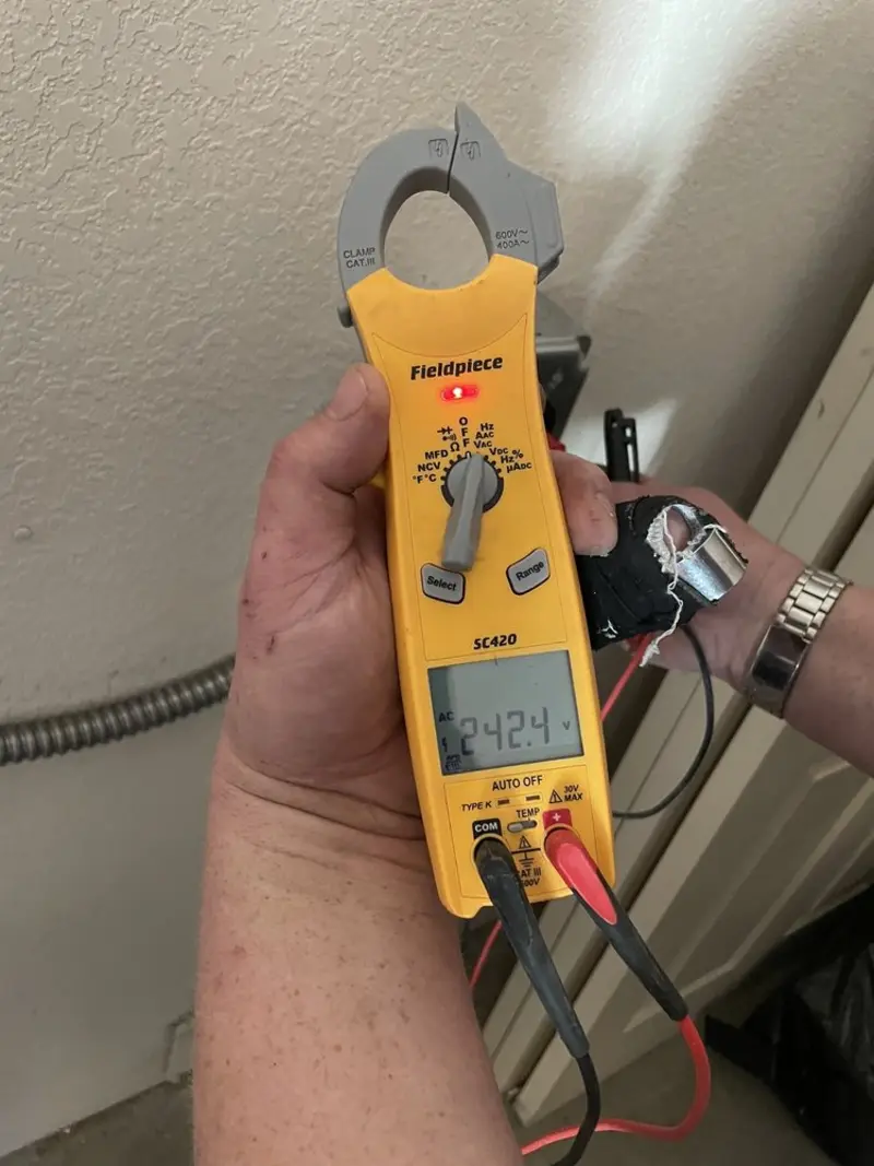 Voltage testing with clamp meter during Electrical Installation Services in Halifax